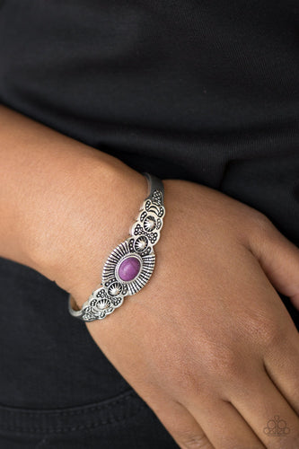 Dotted with a vivacious purple stone center, a dainty silver cuff radiating with shimmery southwestern inspired detail curls around the wrist for a seasonal look.  Sold as one individual bracelet.  Always nickel and lead free.