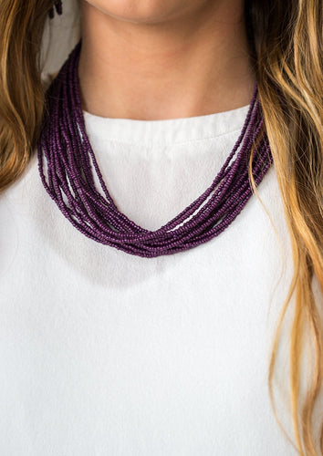 Infused with two large silver fittings, vivacious purple seed beads are threaded along countless strands, creating dramatic layers below the collar for a seasonal look. Features an adjustable clasp closure.  Sold as one individual necklace. Includes one pair of matching earrings.