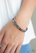 Load image into Gallery viewer, Embossed in swirling silver and feather like detail, antiqued silver frames are threaded along stretchy bands around the wrist. Fiery red stones adorn the centers of the Southwestern frames for a seasonal finish.  Sold as one individual bracelet.  Always nickel and lead free.