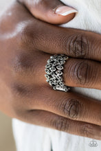 Load image into Gallery viewer, Sprinkled in glittery hematite rhinestones, the leafy silver frame vines across the finger, coalescing into a thick band. Features a stretchy band for a flexible fit.  Sold as one individual ring.  Always nickel and lead free.