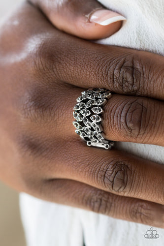 Sprinkled in glittery hematite rhinestones, the leafy silver frame vines across the finger, coalescing into a thick band. Features a stretchy band for a flexible fit.  Sold as one individual ring.  Always nickel and lead free.