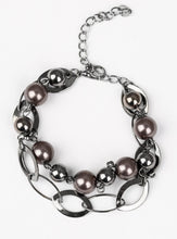 Load image into Gallery viewer, Necklace:  Two rows of classic gunmetal and pearly black beads, and glistening gunmetal hoops link below the collar in a refined fashion. Features an adjustable clasp closure.  Bracelet: Two rows of classic gunmetal and pearly black beads, and glistening gunmetal hoops link around the wrist in a refined fashion. Features an adjustable clasp closure.  Sold as one individual necklace, earrings, and bracelet.