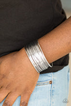 Load image into Gallery viewer,   Glistening silver wire wraps back and forth along an airy silver frame, creating a bold industrial cuff.  Sold as one individual bracelet.   Always nickel and lead free!