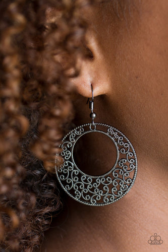 Dotted gunmetal filigree climbs an airy silver frame for a seasonal look. Earring attaches to a standard fishhook fitting.  Sold as one pair of earrings.