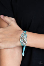 Load image into Gallery viewer, Shiny silver beads are threaded along row after row of shiny blue cording around the wrist for a colorful look. Features an adjustable sliding knot closure.  Sold as one individual bracelet.  Always nickel and lead free.