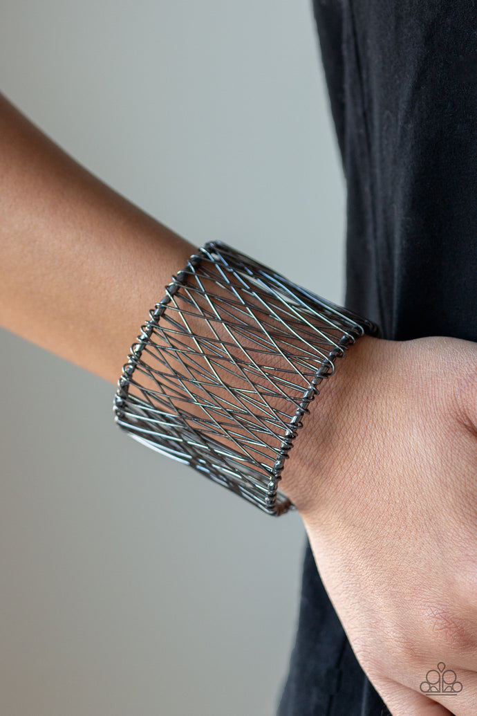 Wire after wire crisscrosses across the wrist, coalescing into an edgy cuff.  Sold as one individual bracelet.   Always nickel and lead free.