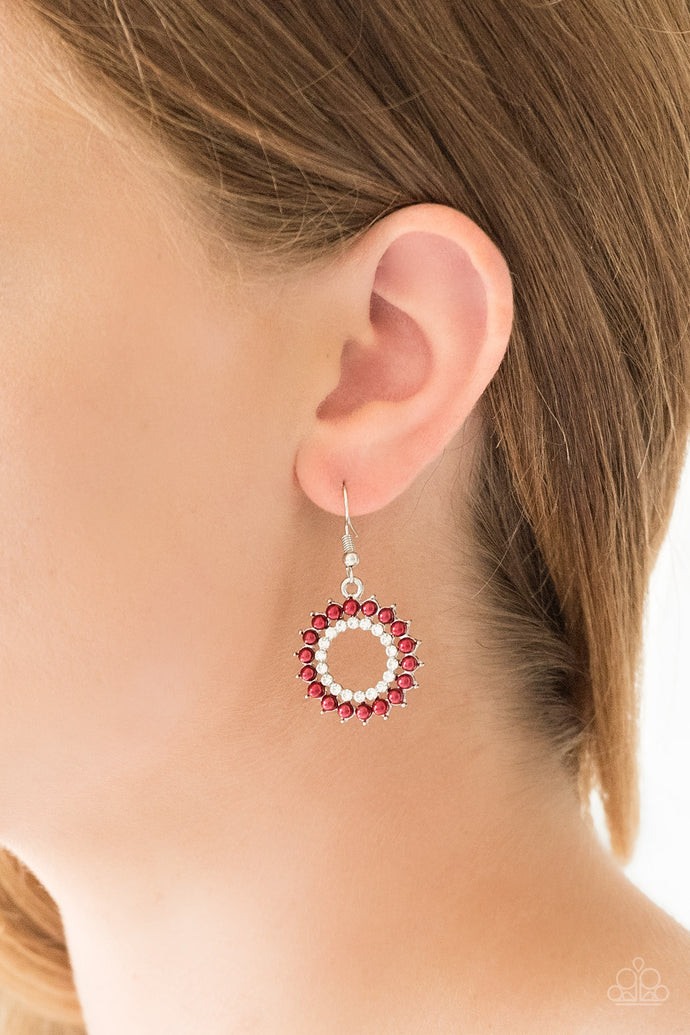 Dainty red pearls spin around a radiant white rhinestone center, coalescing into a refined hoop. Earring attaches to a standard fishhook fitting.  Sold as one pair of earrings.   Always nickel and lead free.