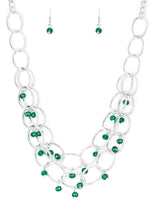 Load image into Gallery viewer, Green crystal-like beads swing from two layers of oversized silver links below the collar for a refined look. Features an adjustable clasp closure.  Sold as one individual necklace. Includes one pair of matching earrings.