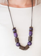 Load image into Gallery viewer, Brushed in a vibrant finish, purple wooden beads and brown wooden discs are threaded along shiny brown cording for a summery look. Features an adjustable sliding knot closure.  Sold as one individual necklace. Includes one pair of matching earrings.