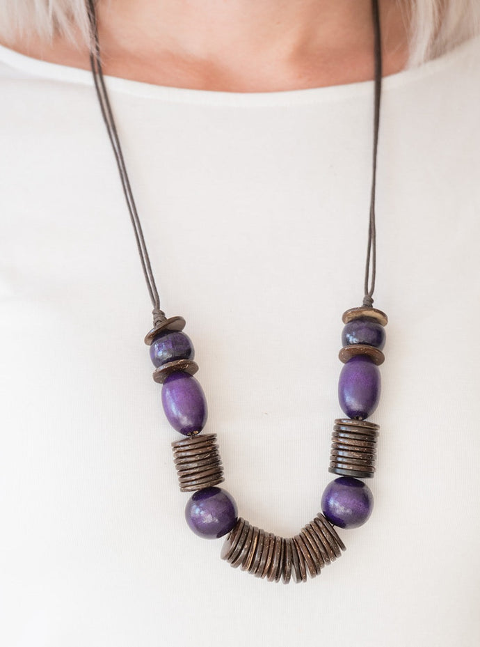 Brushed in a vibrant finish, purple wooden beads and brown wooden discs are threaded along shiny brown cording for a summery look. Features an adjustable sliding knot closure.  Sold as one individual necklace. Includes one pair of matching earrings.