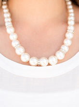 Load image into Gallery viewer, Gradually increasing in size, luminescent pearls trickle below the collar for a classic look. Encrusted in dazzling white rhinestones, glittery rings are sprinkled between the pearls for a timeless finish. Features an adjustable clasp closure.  Sold as one individual necklace. Includes one pair of matching earrings.