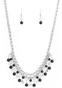 Glittery white rhinestones and classic black beads swing from the bottom of interlocking silver chains, creating a bubbly fringe below the collar. Features an adjustable clasp closure.  Sold as one individual necklace. Includes one pair of matching earrings.  