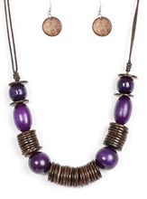 Load image into Gallery viewer, Brushed in a vibrant finish, purple wooden beads and brown wooden discs are threaded along shiny brown cording for a summery look. Features an adjustable sliding knot closure.  Sold as one individual necklace. Includes one pair of matching earrings.