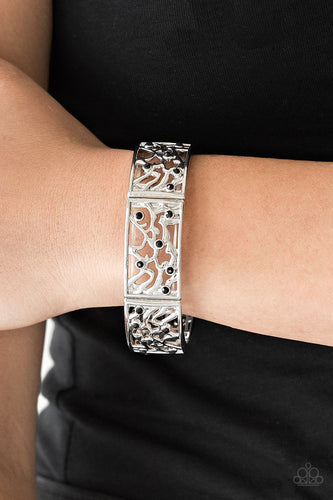 Filled with vine-like filigree, shimmery silver frames are threaded along stretchy bands around the wrist for a whimsical look. Dainty black rhinestones are sprinkled along the ornate frames for a sparkling finish.  Sold as one individual bracelet.   Always nickel and lead free.