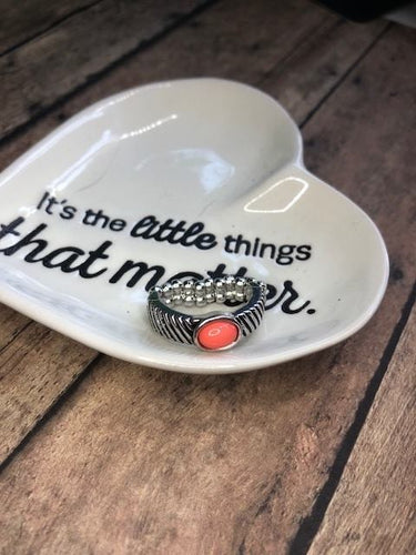 A refreshing orange bead is pressed into a dainty silver band radiating with striped texture for a seasonal look. Features a dainty stretchy band for a flexible fit.  Sold as one individual ring.  Always nickel and lead free.